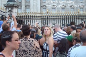 People in a mass crowd. outside Buckingham Palace, waiting for Royal baby news